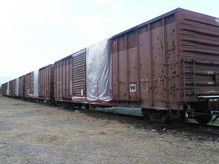 Box Cars of Hay Being Fumigated